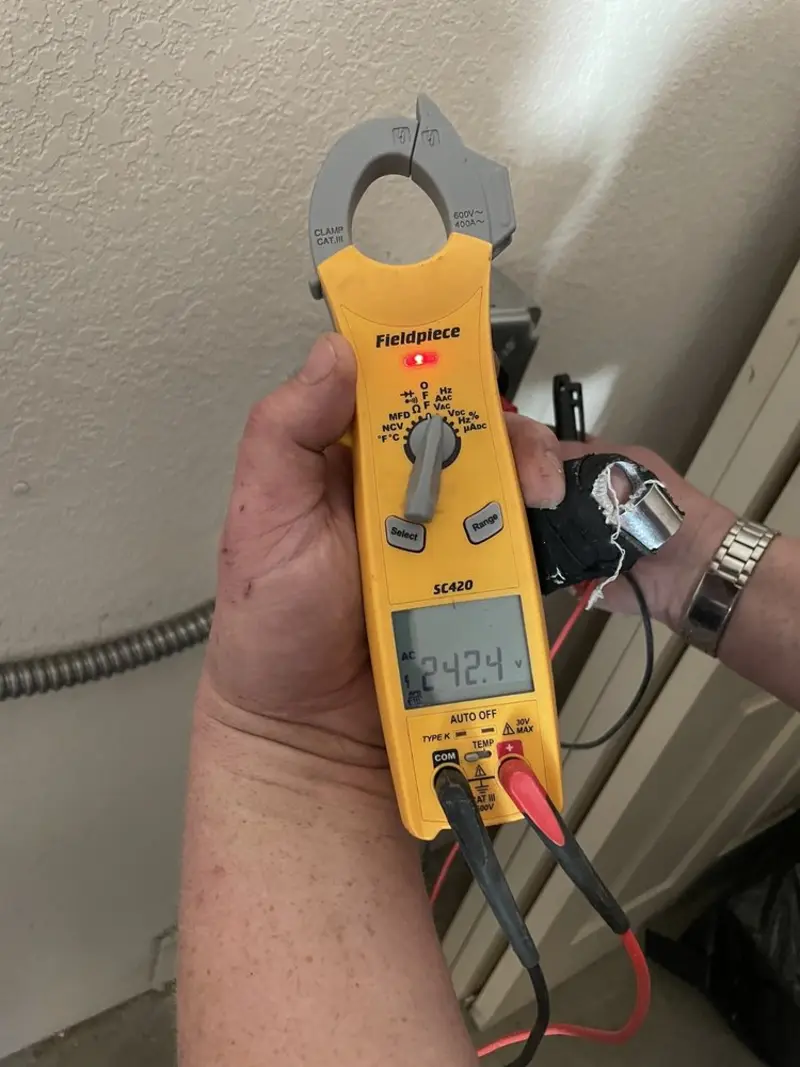 Voltage testing with clamp meter during Electrical Installation Services in Dale City